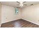 Simple bedroom featuring wood-look flooring, a ceiling fan, and a window for natural light at 1119 Highway 218 W Hwy, Indian Trail, NC 28079