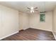 This bedroom features new vinyl flooring, a ceiling fan, and natural light at 1119 Highway 218 W Hwy, Indian Trail, NC 28079