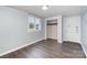 Bright bedroom features a window providing lots of light and an open closet at 1119 Highway 218 W Hwy, Indian Trail, NC 28079