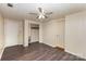 Bedroom with new vinyl flooring, closet storage, and multiple doorways at 1119 Highway 218 W Hwy, Indian Trail, NC 28079