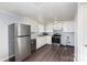 Kitchen with stainless steel appliances, updated flooring, and neutral color scheme at 1119 Highway 218 W Hwy, Indian Trail, NC 28079