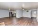 Open kitchen with stainless steel appliances and updated wood-look flooring at 1119 Highway 218 W Hwy, Indian Trail, NC 28079