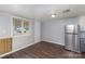Eat-in kitchen area features updated stainless steel refrigerator and a large window at 1119 Highway 218 W Hwy, Indian Trail, NC 28079