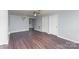 Large living area with a ceiling fan, wood-look flooring, and ample natural light at 1119 Highway 218 W Hwy, Indian Trail, NC 28079