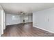 Spacious living room with vinyl wood flooring, painted walls, and a ceiling fan at 1119 Highway 218 W Hwy, Indian Trail, NC 28079