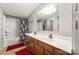 Bathroom with dual sinks and a shower-tub combo, providing comfort and convenience at 114 Oakland Rd, Belmont, NC 28012