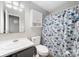 Bathroom featuring a floral shower curtain, white toilet and vanity with mirror at 114 Oakland Rd, Belmont, NC 28012
