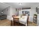 Bright dining area featuring a large table, chairs, and seamless flow into the living room at 114 Oakland Rd, Belmont, NC 28012