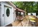 Inviting front porch features a porch swing and table and chairs for relaxing at 114 Oakland Rd, Belmont, NC 28012
