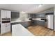 Updated kitchen with stainless steel appliances, white countertops, and gray cabinets at 114 Oakland Rd, Belmont, NC 28012
