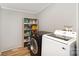 Functional laundry room with shelving, and front loading Samsung washer and dryer at 114 Oakland Rd, Belmont, NC 28012
