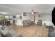 Spacious living room showcasing comfortable furniture and seamless flow into the adjacent kitchen and dining spaces at 114 Oakland Rd, Belmont, NC 28012