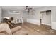 Comfortable living room with wood floors, a cozy sofa, and an adjacent entry way to the bathroom at 114 Oakland Rd, Belmont, NC 28012