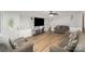 Cozy living room with stylish sofas, a ceiling fan, and modern entertainment setup at 114 Oakland Rd, Belmont, NC 28012