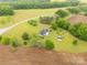 Spacious acreage features a well-maintained home, storage buildings and beautiful landscaping at 1162 E Doc Garris Rd, Lancaster, SC 29720