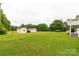 Lush backyard featuring two storage sheds with ample green space at 1162 E Doc Garris Rd, Lancaster, SC 29720