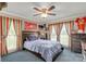 This is a comfortable bedroom with a large bed and lots of natural light at 1162 E Doc Garris Rd, Lancaster, SC 29720