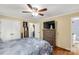 A bedroom featuring hardwood floors, a ceiling fan, and closet at 1162 E Doc Garris Rd, Lancaster, SC 29720