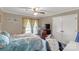 This is a bedroom with neutral walls, ceiling fan and double door closet at 1162 E Doc Garris Rd, Lancaster, SC 29720