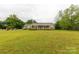 Lovely brick home with a well maintained lawn and mature trees at 1162 E Doc Garris Rd, Lancaster, SC 29720