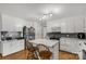 Bright kitchen with white cabinets, granite counters, stainless appliances and an island with seating at 1162 E Doc Garris Rd, Lancaster, SC 29720