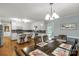 Eat-in kitchen features white cabinets, stainless appliances, and a spacious dining area at 1162 E Doc Garris Rd, Lancaster, SC 29720