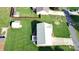 Aerial view of a property showcasing a well-maintained lawn, a shed, and surrounding neighborhood streets at 123 Cross Creek Dr, Statesville, NC 28625
