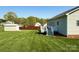 Large backyard with a well-manicured lawn, white deck and fence at 123 Cross Creek Dr, Statesville, NC 28625
