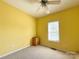 Bright bedroom with a ceiling fan, neutral carpet, and window with natural light at 123 Cross Creek Dr, Statesville, NC 28625