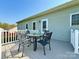 Exterior view of a charming deck with a round table and chairs at 123 Cross Creek Dr, Statesville, NC 28625