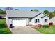 Charming single-story home with a spacious two-car garage, enhanced by well-manicured landscaping in front at 123 Cross Creek Dr, Statesville, NC 28625