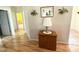 Bright hallway with wood floors, decorative plants, and ample natural light, connecting the home's living spaces at 123 Cross Creek Dr, Statesville, NC 28625