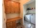 Utility/laundry area includes cabinets, built-in desk, washer, and dryer at 123 Cross Creek Dr, Statesville, NC 28625