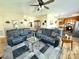 Spacious living room with comfortable sofas, ceiling fan, and stylish coffee table, perfect for relaxation at 123 Cross Creek Dr, Statesville, NC 28625