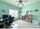 Bright office with a desk, chair, and storage, perfect for work or study with plenty of natural light at 123 Cross Creek Dr, Statesville, NC 28625
