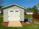 Exterior shed in a large lot with surrounding trees and well kept yard at 123 Cross Creek Dr, Statesville, NC 28625