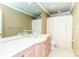 This bathroom offers dual clear bowl sinks with a large mirror and a shower at 1233 Weymouth Ln, Charlotte, NC 28270