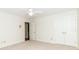 This bedroom features neutral carpet, white walls, and has a ceiling fan at 1233 Weymouth Ln, Charlotte, NC 28270
