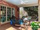 This brick-paved, covered patio features wicker furniture and great views of the garden at 1233 Weymouth Ln, Charlotte, NC 28270