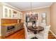 Charming dining room featuring stylish decor, a chandelier, and a serving bar at 1233 Weymouth Ln, Charlotte, NC 28270
