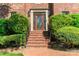 Elegant brick front steps leading to a beautiful wood and glass paneled front door at 1233 Weymouth Ln, Charlotte, NC 28270