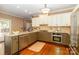 Spacious kitchen with granite countertops, stainless steel appliances, and wooden cabinetry at 1233 Weymouth Ln, Charlotte, NC 28270