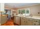 Bright kitchen with granite countertops, stainless steel appliances, and a view to the patio at 1233 Weymouth Ln, Charlotte, NC 28270