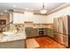 Well-equipped kitchen with granite countertops, stainless steel appliances, and modern cabinets at 1233 Weymouth Ln, Charlotte, NC 28270