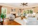 Comfortable living room with fireplace, hardwood floors, and ample natural light at 1233 Weymouth Ln, Charlotte, NC 28270