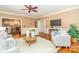 Inviting living room featuring hardwood floors, a ceiling fan, and view to the modern kitchen at 1233 Weymouth Ln, Charlotte, NC 28270