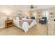 Bright main bedroom with built-in bookshelves, plush carpet, and neutral color scheme at 1233 Weymouth Ln, Charlotte, NC 28270