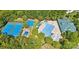 Aerial view of community amenities including tennis courts, a playground, and a large swimming pool at 14220 Stewarts Bend Ln, Charlotte, NC 28277