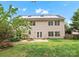 Large backyard featuring a patio, seating area and lush green lawn, perfect for outdoor entertaining at 14220 Stewarts Bend Ln, Charlotte, NC 28277