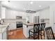 Bright, all-white kitchen featuring stainless steel appliances, a butcher block island, and hardwood floors at 14220 Stewarts Bend Ln, Charlotte, NC 28277
